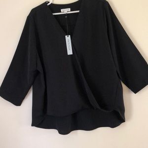 Stylish cross I’ve fit with v neck. Longer back. crepe feeling to fabric.